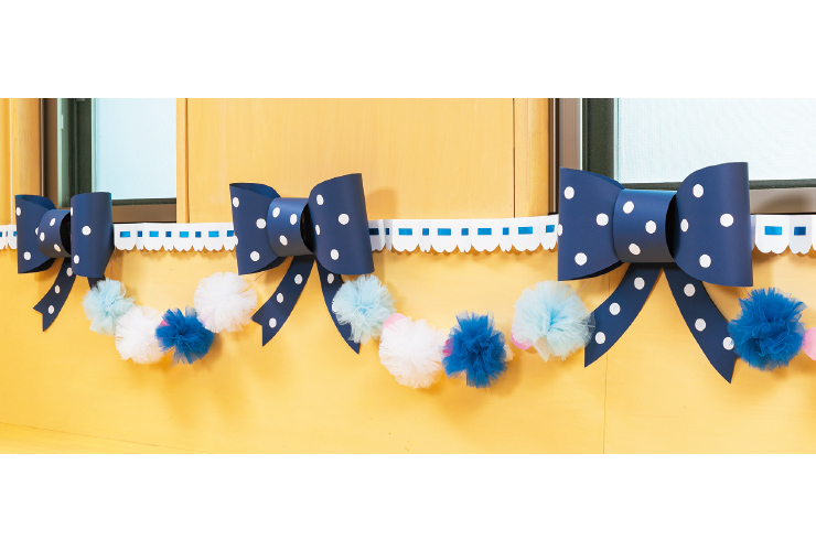 ⼤きなリボンの会場飾り あなたの保育をサポートする「My Wonder(マイワンダー)」 ⼤きなリボンの会場飾り あなたの保育をサポートする「My Wonder(マイワンダー)」